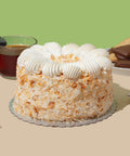 coconut caramel cake with tea and cookies