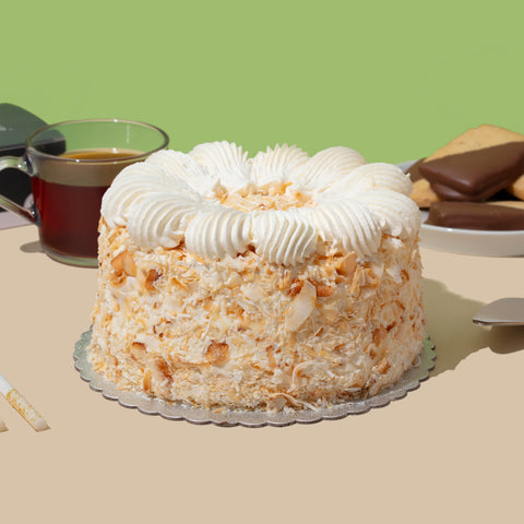 coconut caramel cake with tea and cookies